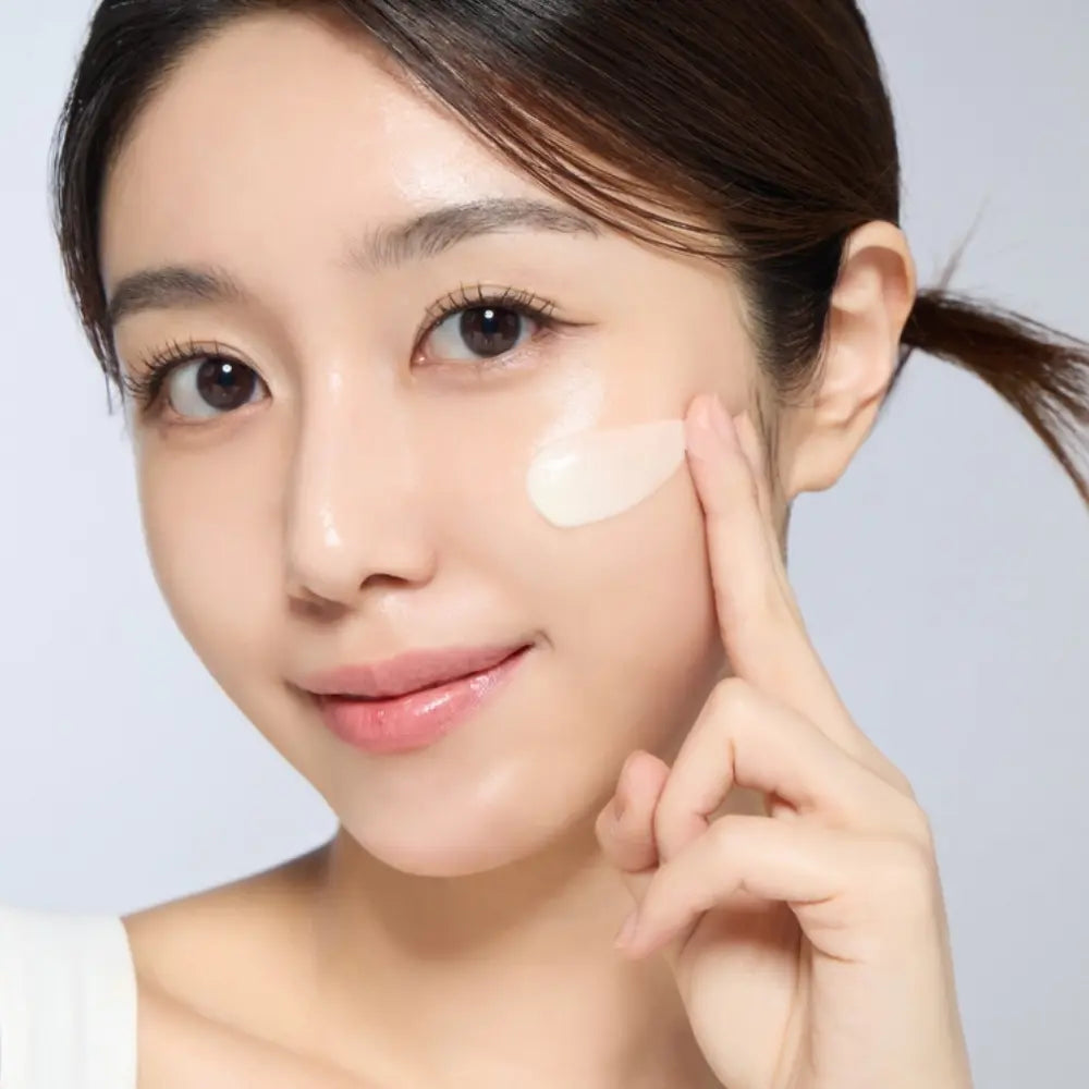 Woman applying Derma Silk Repair Cream for intensive moisture care on dry skin